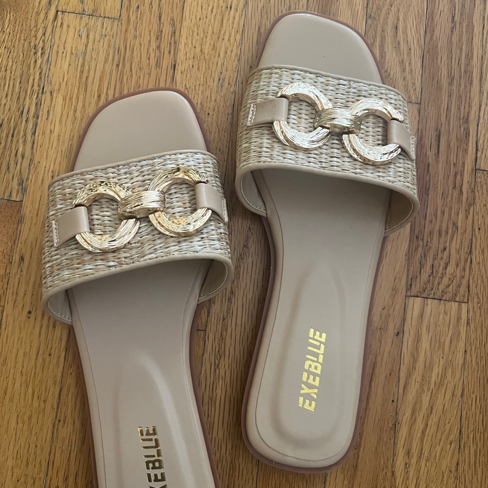 Woman’s slides. Brand new, never worn. Comfy and stylish.